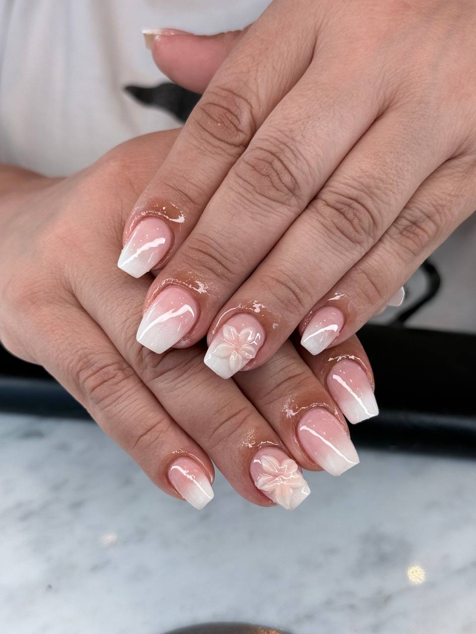 Soft ombré nails with hand-painted white flowers