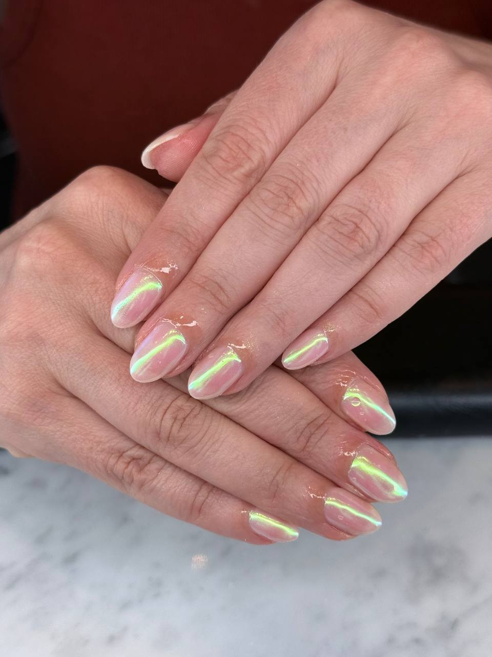 Iridescent chrome manicure with a glass-like finish